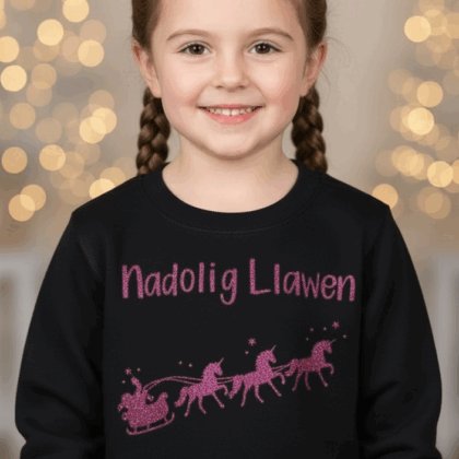 Pink unicorn on black Welsh child Christmas jumper-ready made